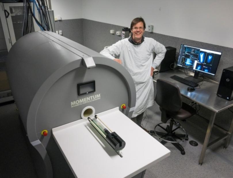 UNSW Dr Andre Bongers standing next to Australia’s first Magnetic Particle Imaging facility.